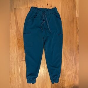 Jaanuu Jogger Scrubs in Caribbean blue size small